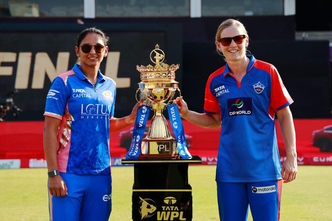 Harmanpreet Kaur and Leg Lanning pose with the WPL 2025 Trophy